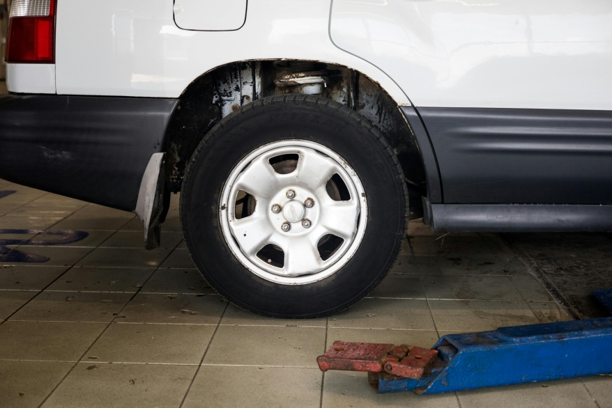 A vehicle tire with visible tread patterns.